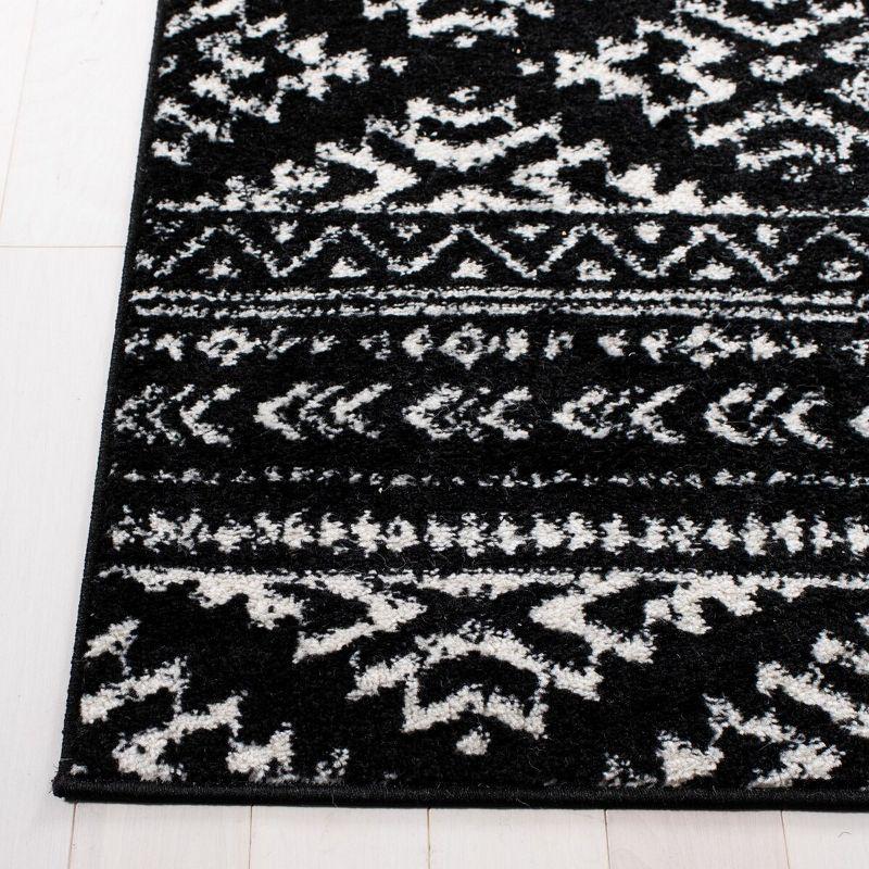 Modern Geometric 4' x 6' Black/Ivory Synthetic Area Rug