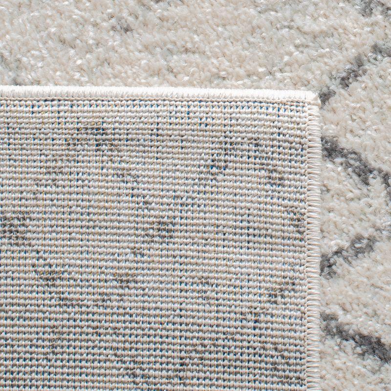 Ivory and Charcoal Geometric Synthetic Area Rug