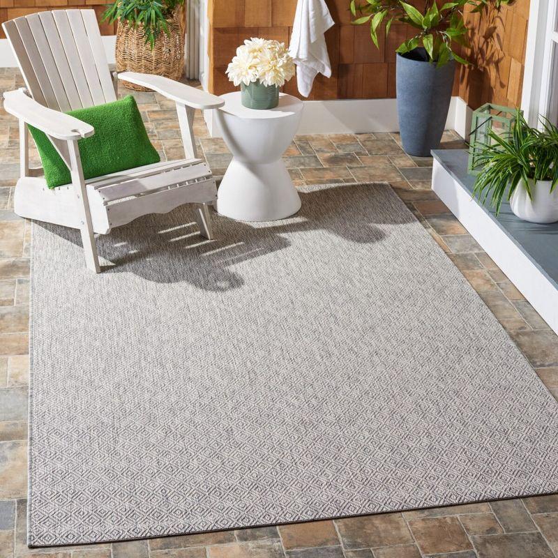 Delano Monochrome Gray Synthetic 6'7" x 9'6" Indoor/Outdoor Rug