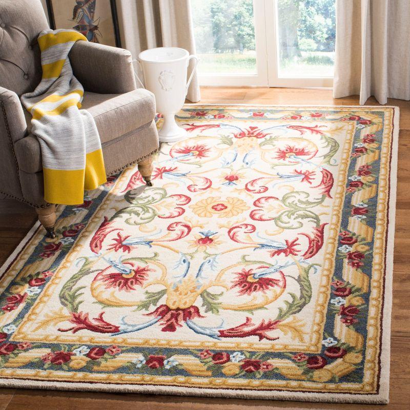 Handmade Ivory Floral Tufted Wool Area Rug 5' x 8'