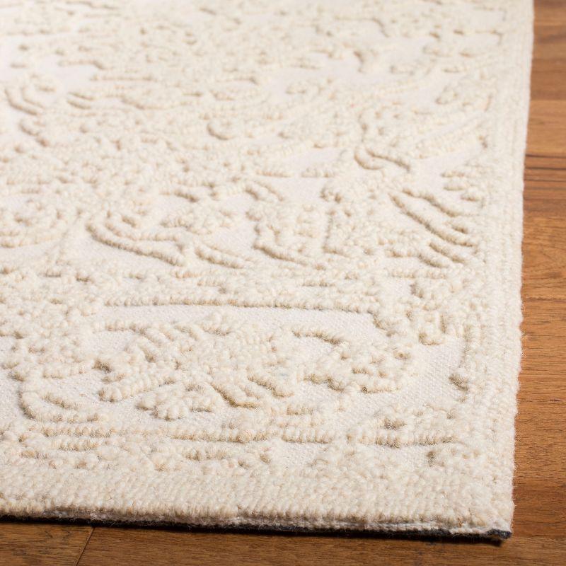 Elegant Ivory Tufted Wool 8' x 10' Handmade Area Rug