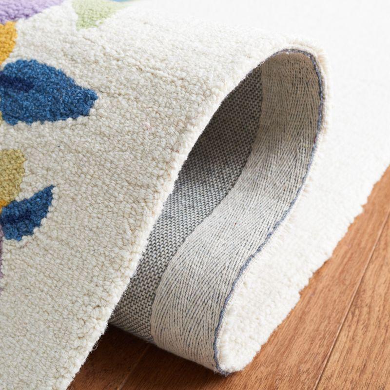 Chelsea HK219 Hand Tufted Area Rug - Ivory/Rose - 3'x5' Oval - Safavieh.