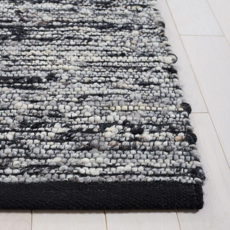 Artisan-Crafted Black Wool 8' x 10' Handwoven Area Rug