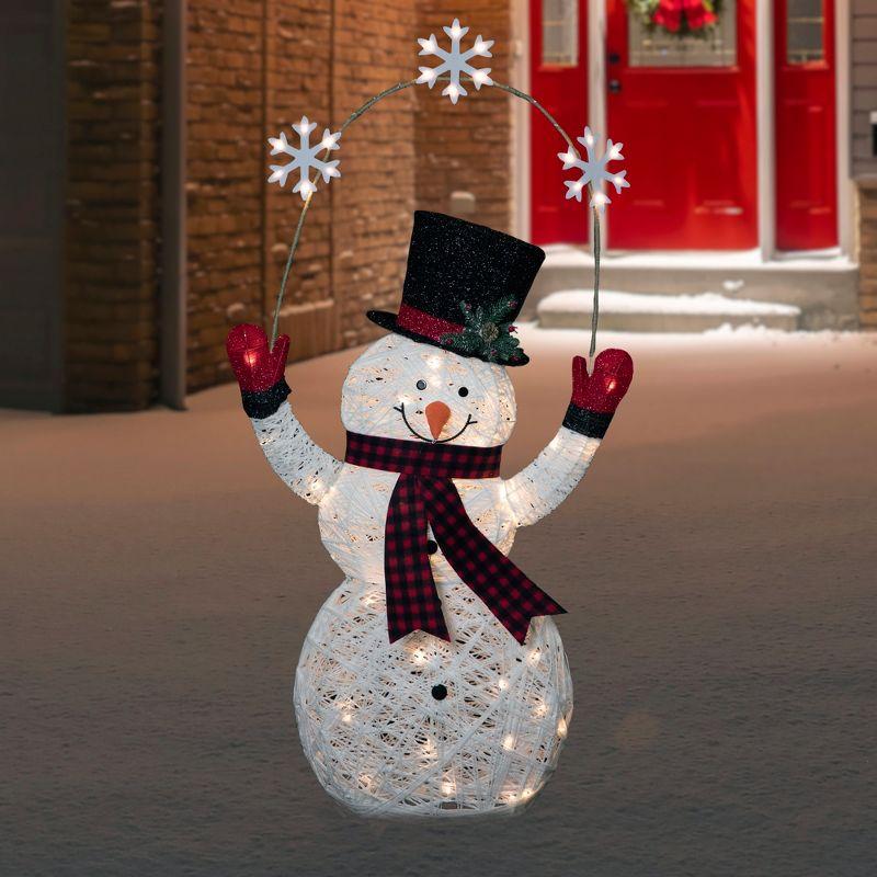 57" LED Lighted Snowman Holding Snowflakes Outdoor Christmas Decoration