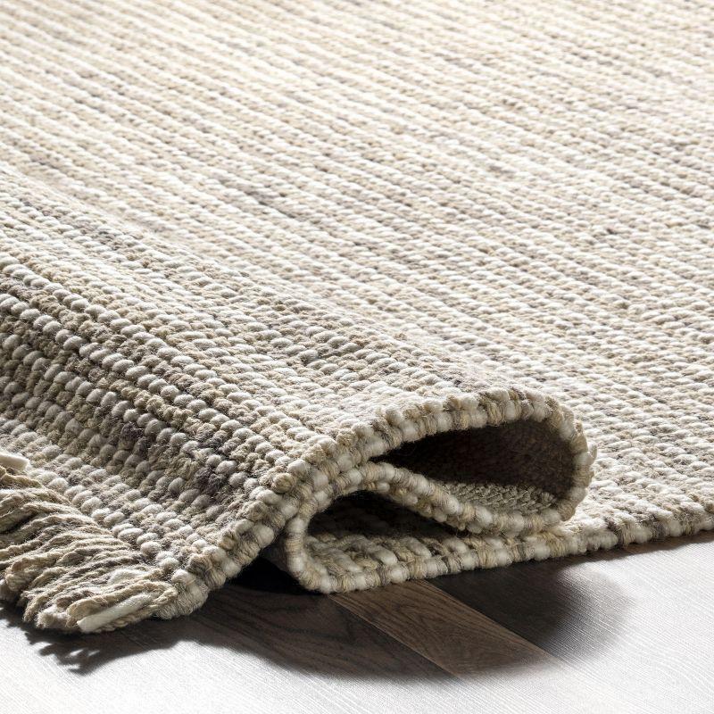 Handwoven Ivory Wool 7'6" x 9'6" Easy-Care Area Rug