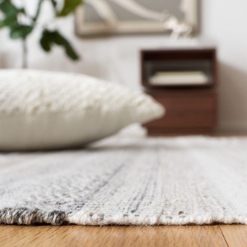 Ivory and Charcoal Flat Woven Synthetic Area Rug