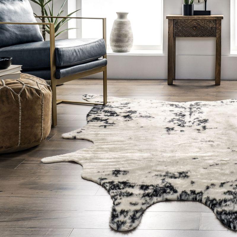 Nuloom Marcia SpinClean Machine Washable Faux Cowhide Area Rug, Shaped 3' 10" x 5', Black
