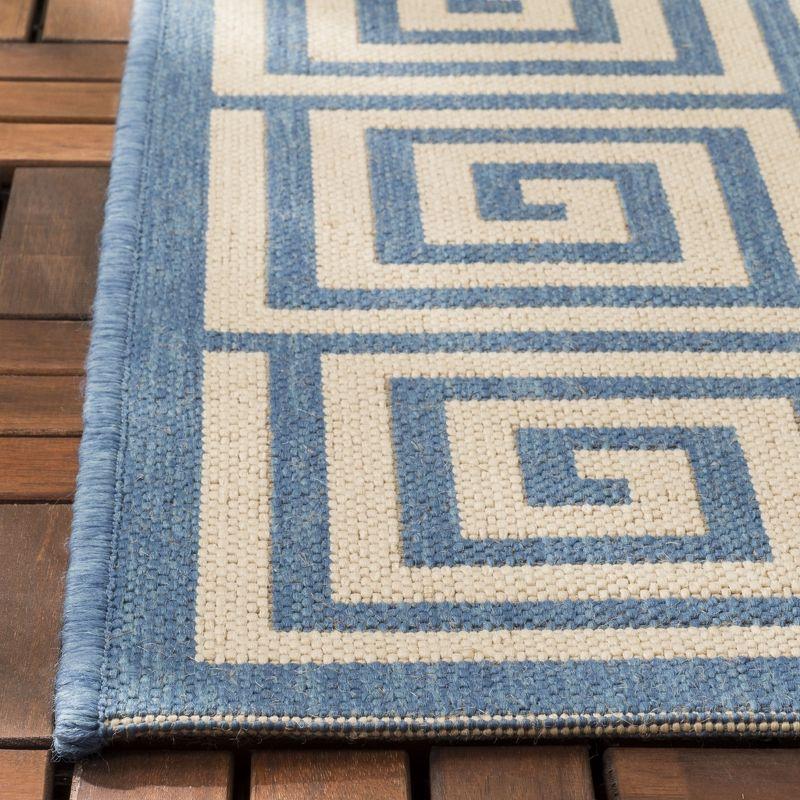 Cream and Blue Geometric 3' x 5' Stain-Resistant Synthetic Rug