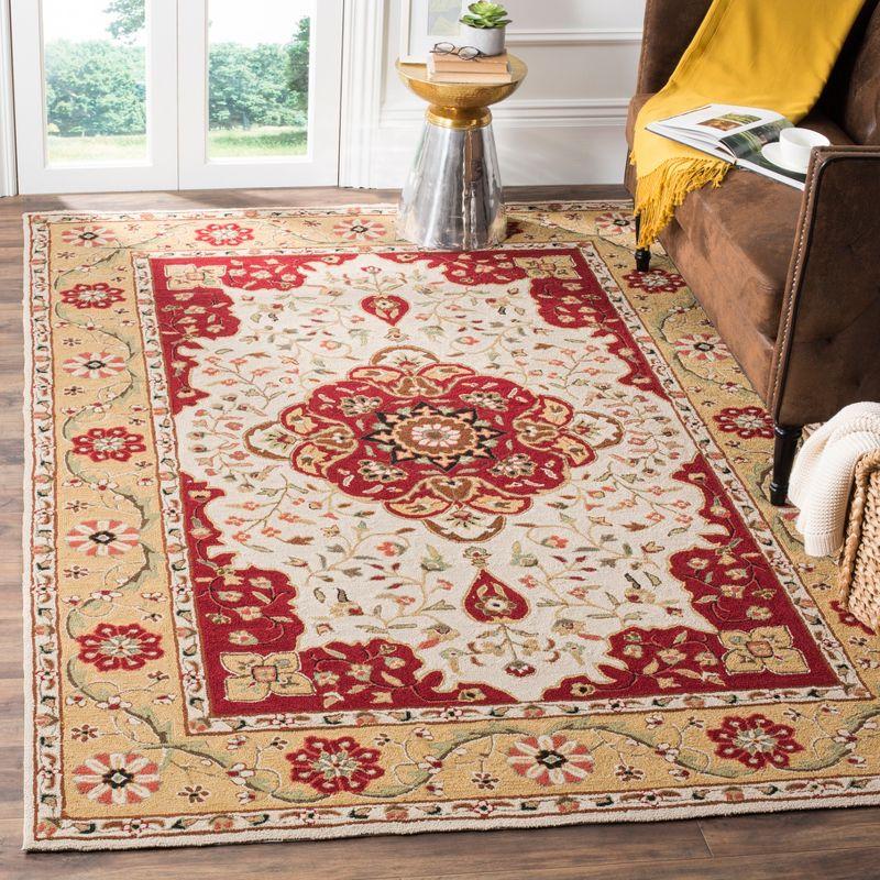 Handmade Cream and Red Synthetic 4' x 6' Area Rug