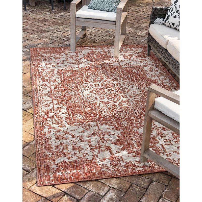 Rust Red and Ivory Synthetic Outdoor Rectangular Rug 4' x 6'