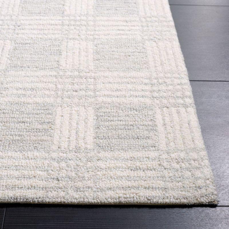 Ivory Hand Tufted Wool Rectangular 6' x 9' Area Rug