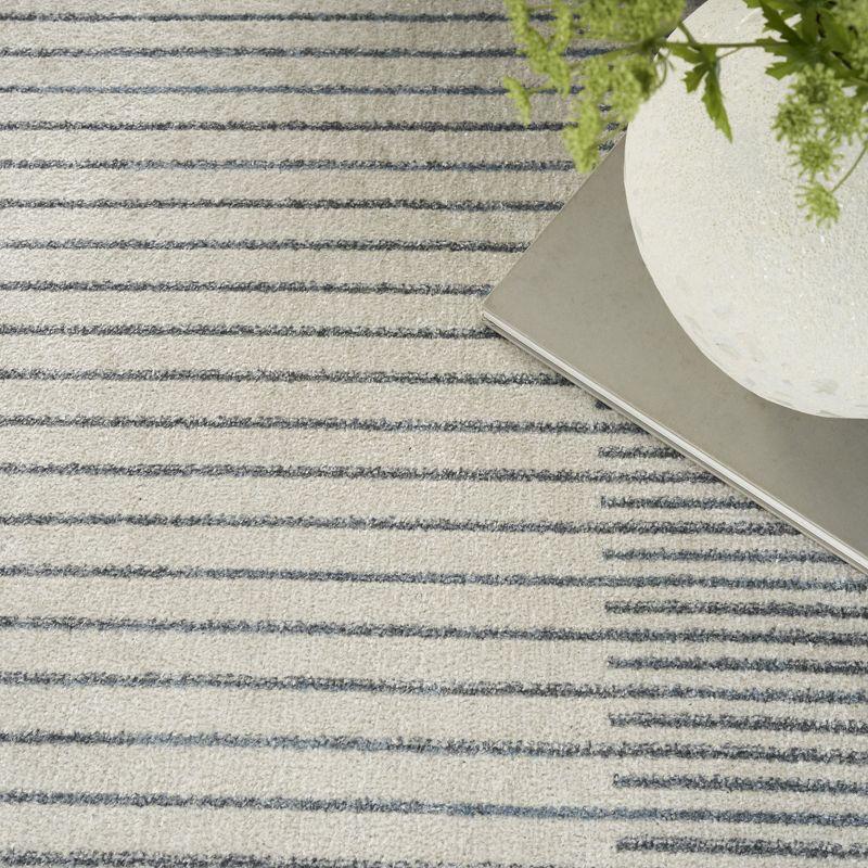 Nourison Astra Machine Washable Stripe Circle Mid-Century Modern Indoor Rug Ivory Blue 5'3" x 7'