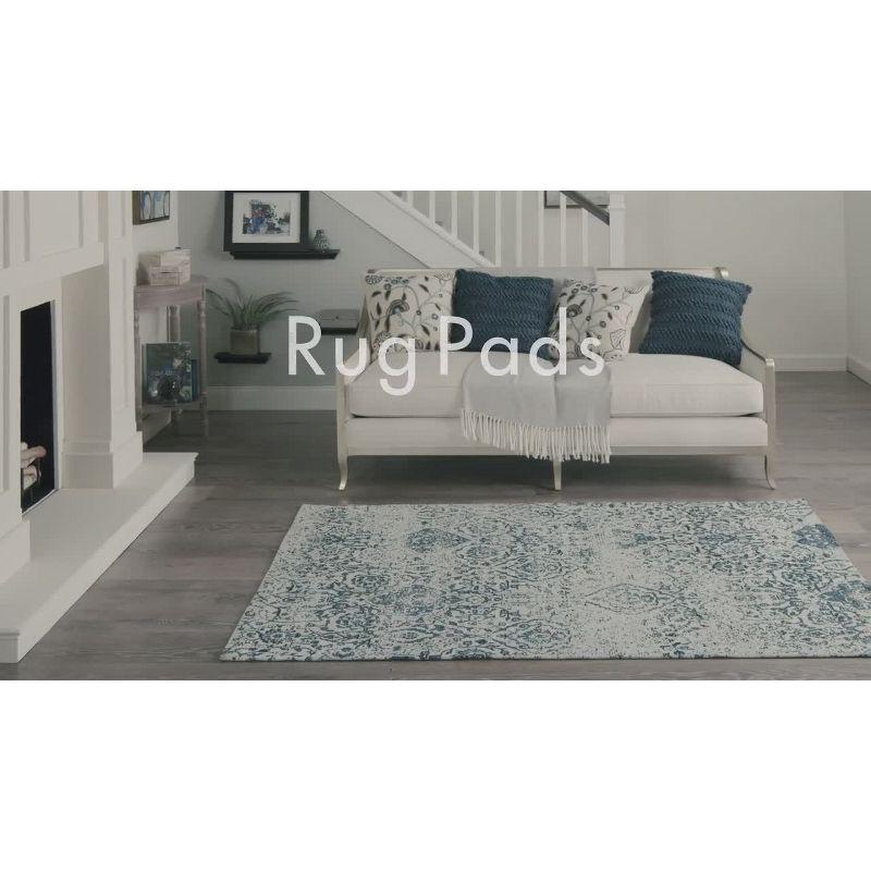 Ebern Designs Rectangle Shiftloc Solid Color Machine Made Polyester/Plastic/Acrylic Area Rug in Ivory