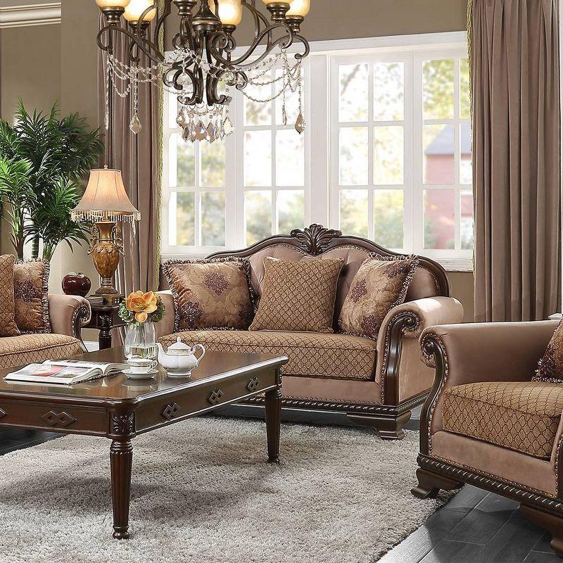 Beige Tufted Fabric Loveseat with Floral Pillows and Nailhead Trim