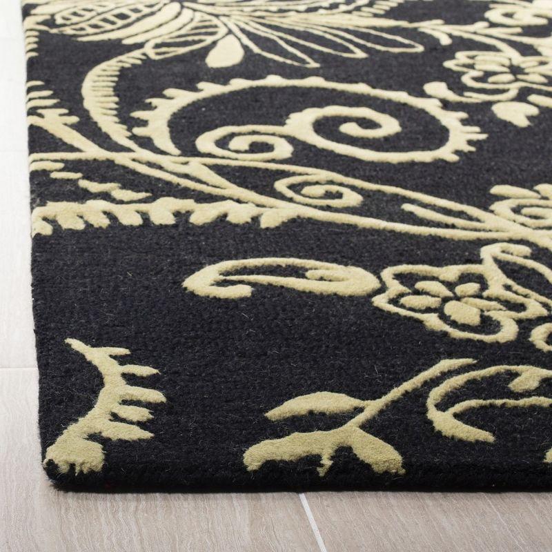 Handmade Black and Yellow Tufted Wool Area Rug