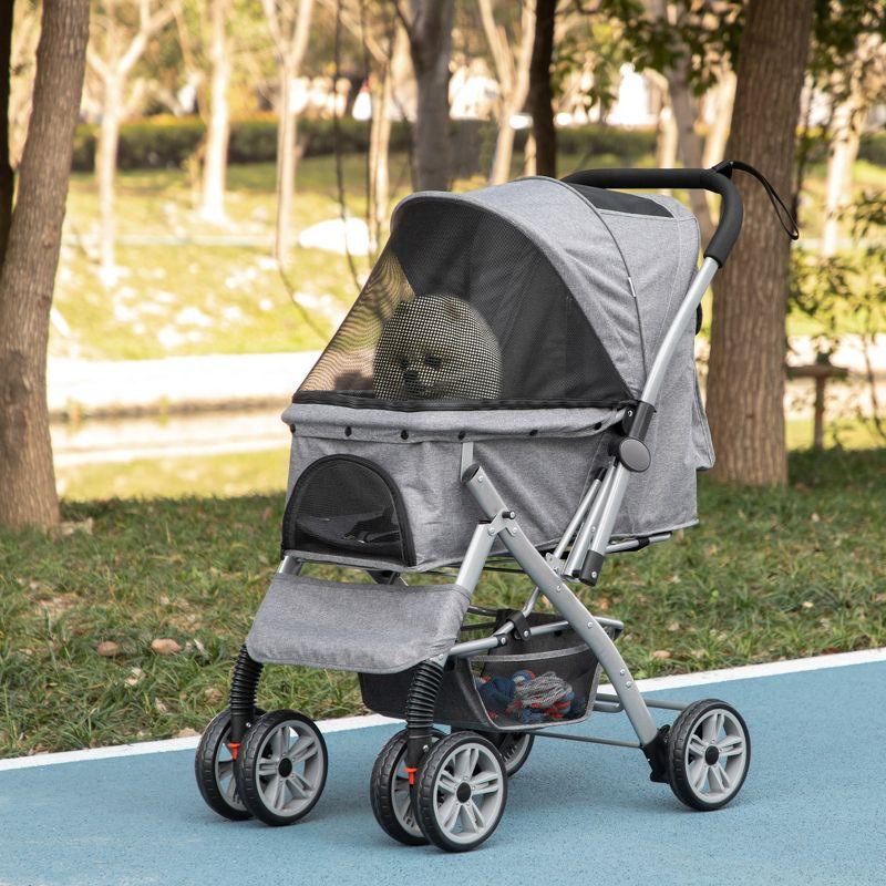 PawHut Travel Pet Stroller for Dogs, Cats, One-Click Fold Jogger Pushchair with Swivel Wheels, Brakes, Basket Storage, Safety Belts, Adjustable Canopy, Zippered Mesh Window Door