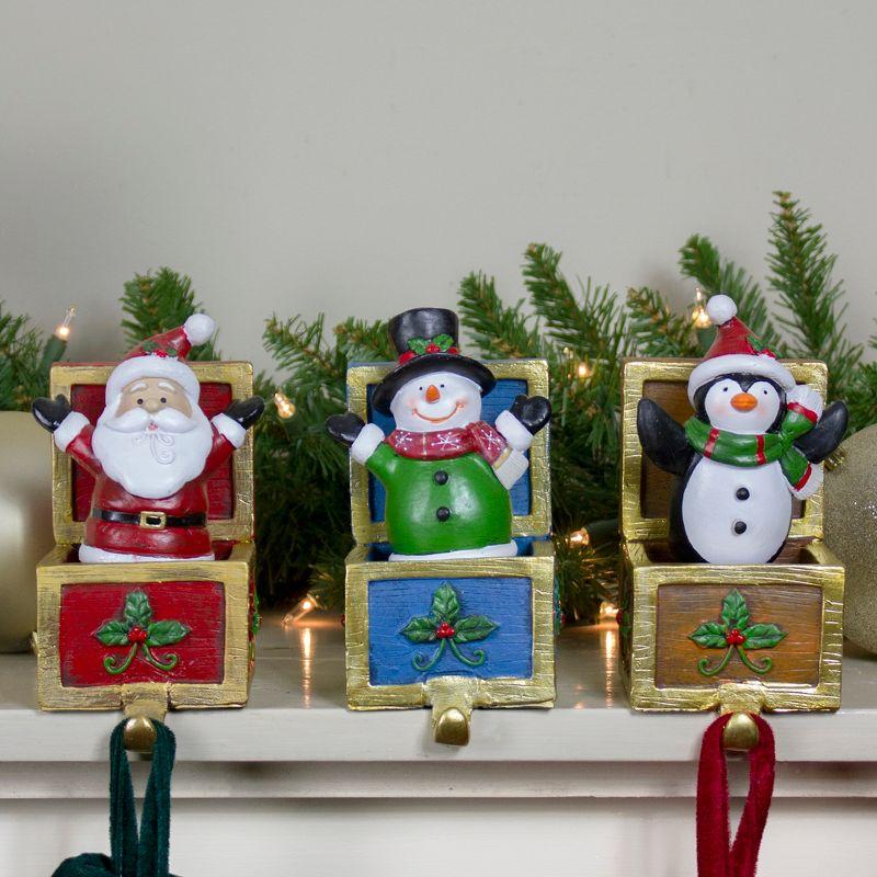 Santa, Snowman, and Penguin Christmas Stocking Holders Set