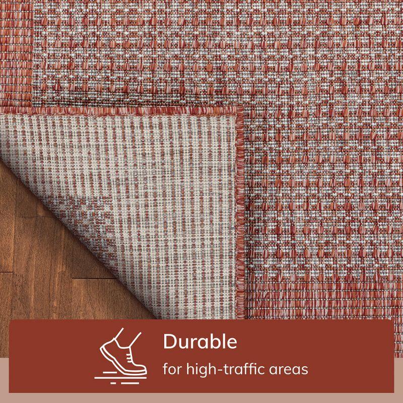 Marshanna Odin Solid Striped Border Indoor Outdoor Coral Flatweave Rug