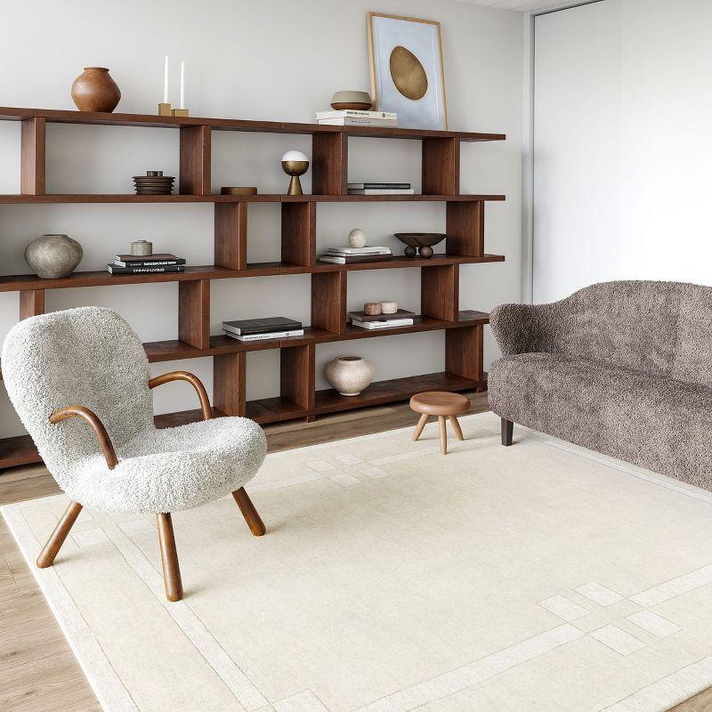 Latitude Run® Rune Bordered Wool-Blend Area Rug