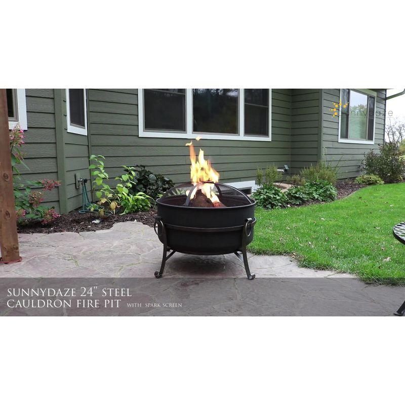 Sunnydaze Outdoor Camping or Backyard Round Cauldron Fire Pit with Spark Screen, Log Poker, and Metal Wood Grate - 24"