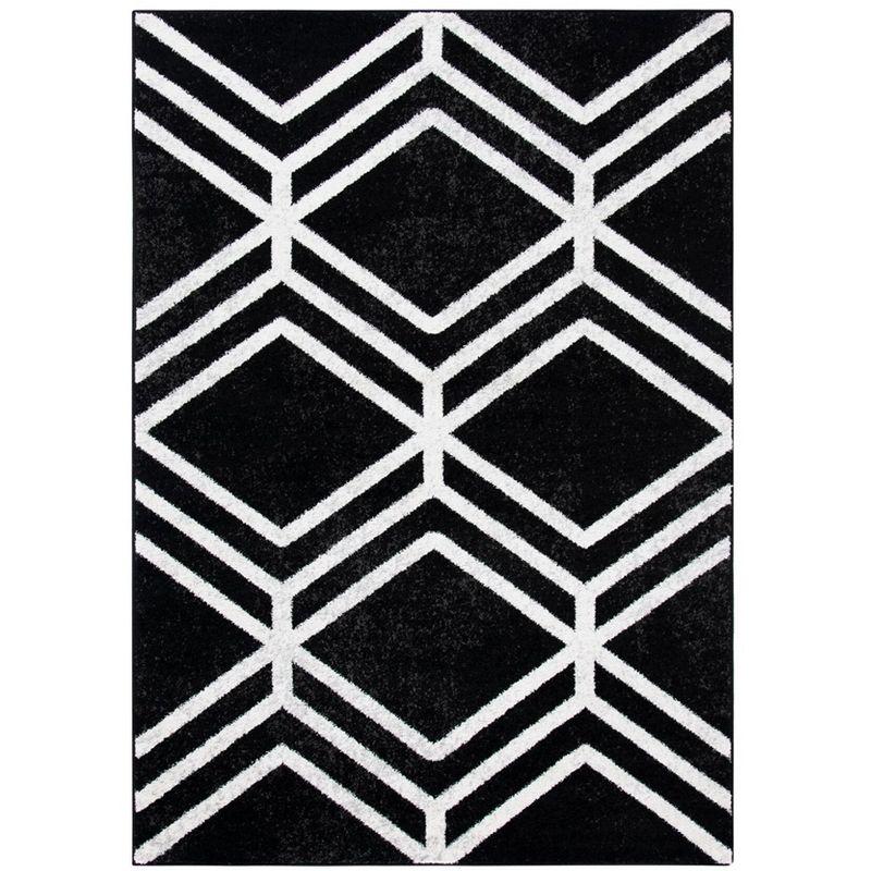 Black and Ivory Geometric 4' x 6' Synthetic Area Rug