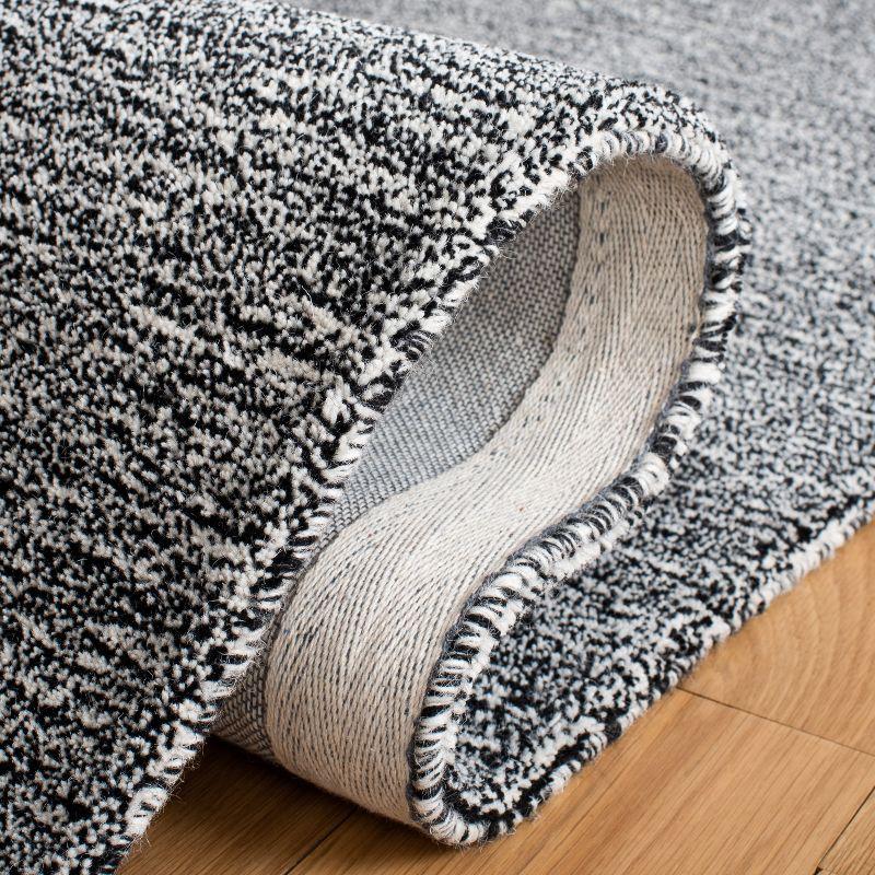Metro MET867 Hand Tufted Indoor Area Rug - Black/Ivory - 5'x8' - Safavieh