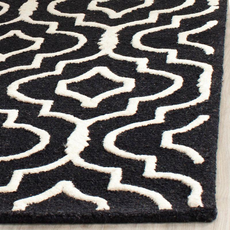 Cannen Hand-Tufted Black/Ivory Area Rug