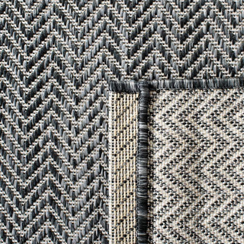 Black and Beige Flat Woven Synthetic Indoor/Outdoor Rug