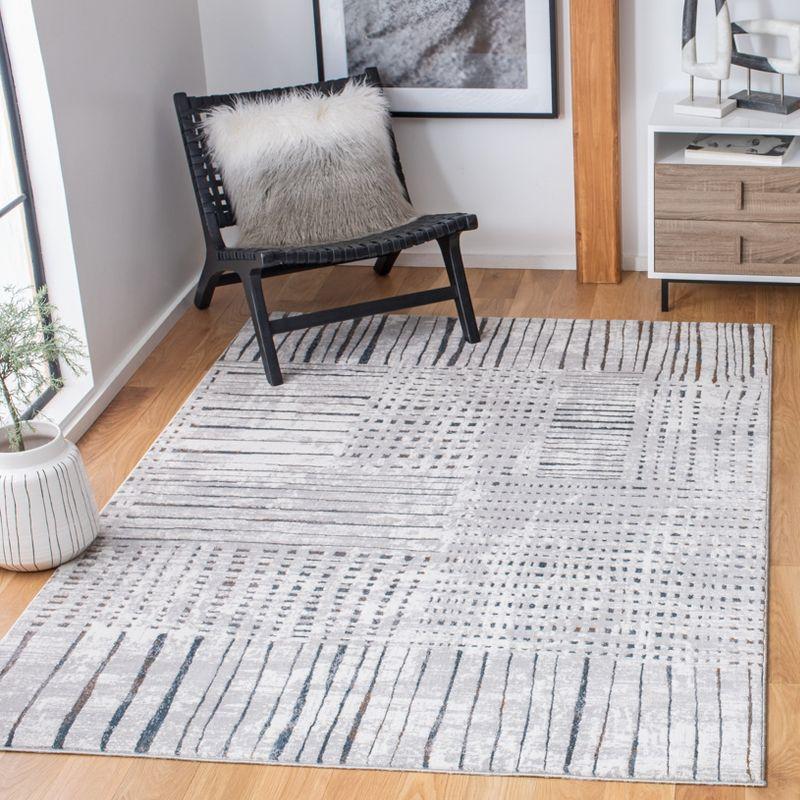 Gray and Ivory Abstract Rectangular Synthetic Area Rug, 5' x 7'