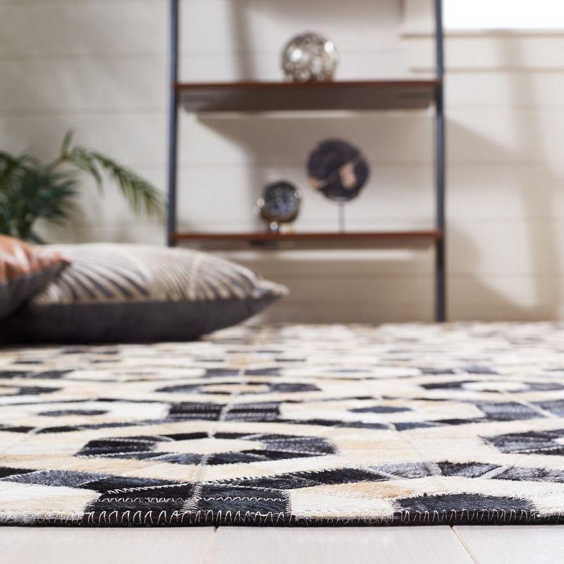 Black and Beige Geometric Handmade Cowhide Area Rug