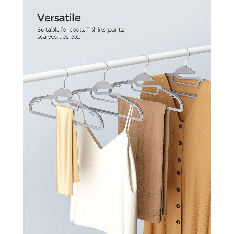 SONGMICS Coat Hangers Non-Slip Clothes Hangers Space-Saving Plastic Hangers 360°Swivel Rose Gold Hook