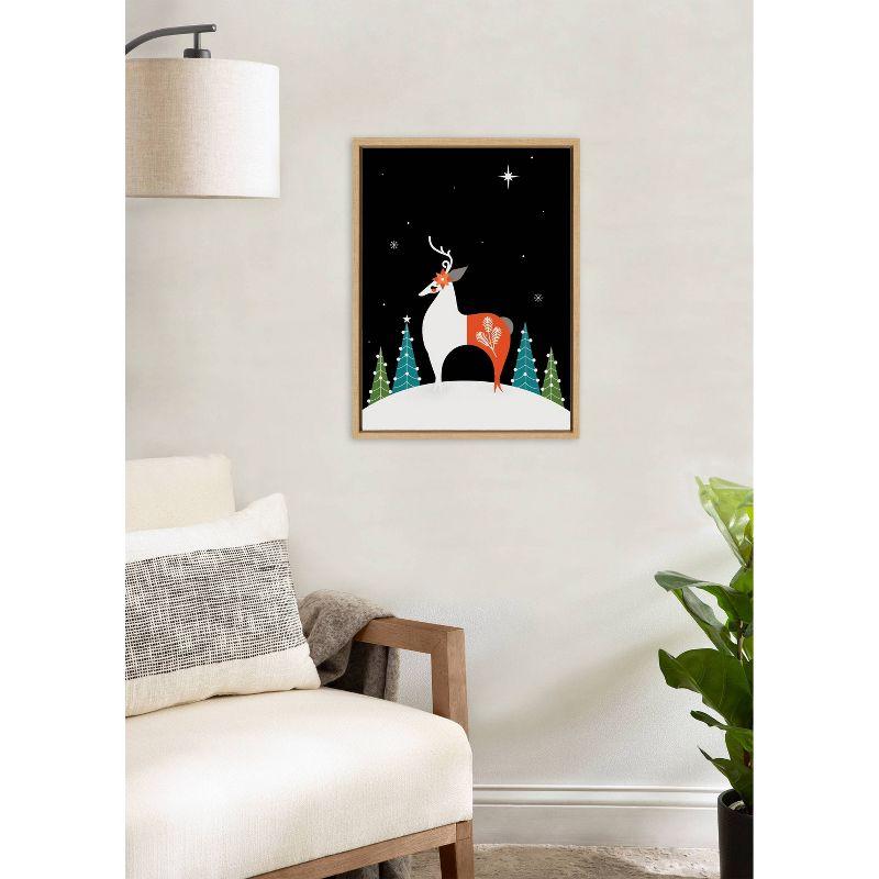 Kate & Laurel All Things Decor 18"x24" Sylvie Season's Greetings Reindeer Framed Canvas Wall Art by Amber Leaders Designs