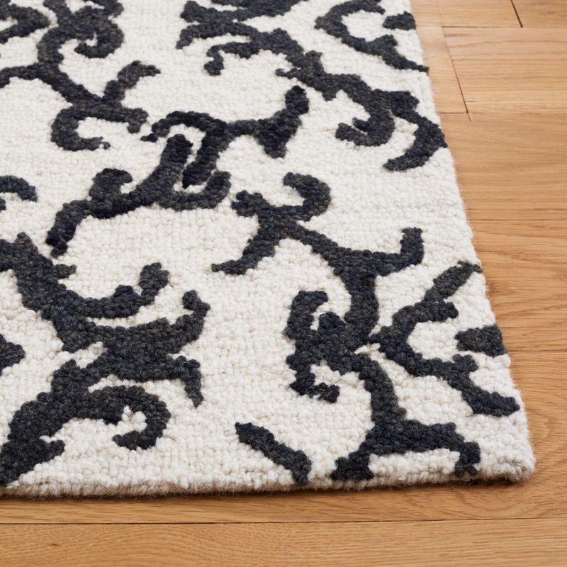 Blossom BLM104 Hand Tufted Area Rug - Ivory/Black - 8'x10' - Safavieh.