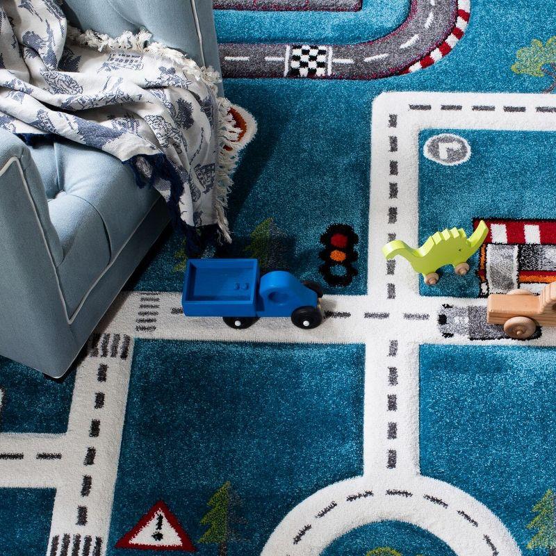 Turquoise and Ivory Kids' Square Play Rug with Train Track Design