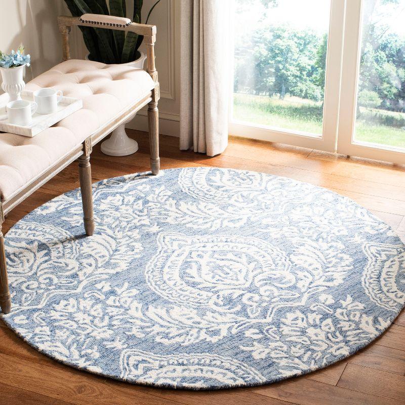 Handmade Blue and Ivory Wool Tufted Round Area Rug