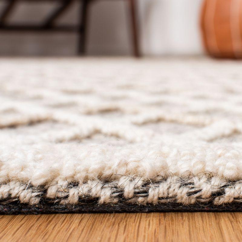 Handmade Black and Ivory Wool Tufted Area Rug