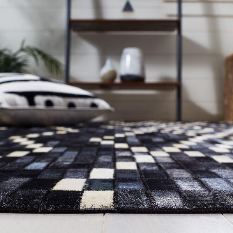 Hand-Stitched Geometric Black Cowhide 4' x 6' Area Rug