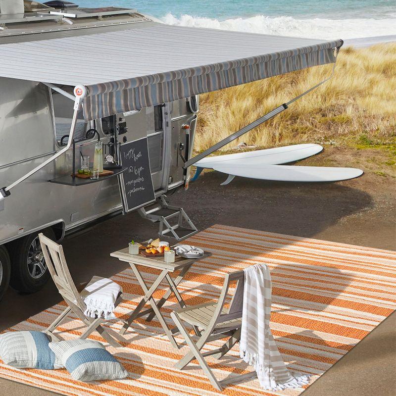 5' x 8' Castara Wavy Stripe Modern Indoor/Outdoor Area Rug, Orange/Cream - JONATHAN Y