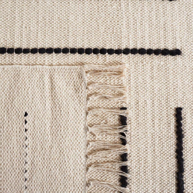 Black and Ivory 4' x 6' Hand Woven Wool Cotton Area Rug