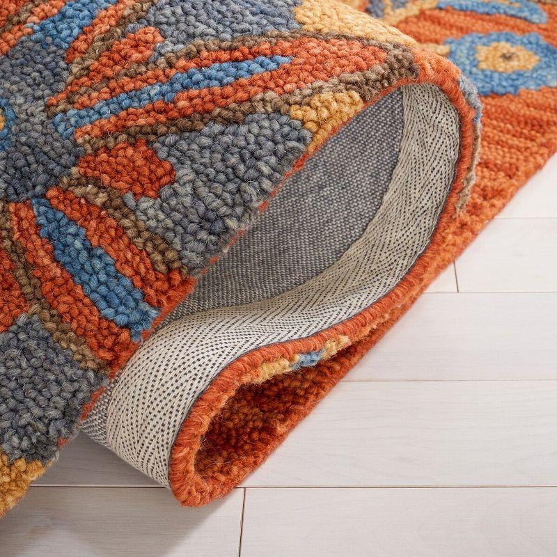 Blossom BLM175 Hand Tufted Area Rug - Rust/Blue - 5'x8' - Safavieh..
