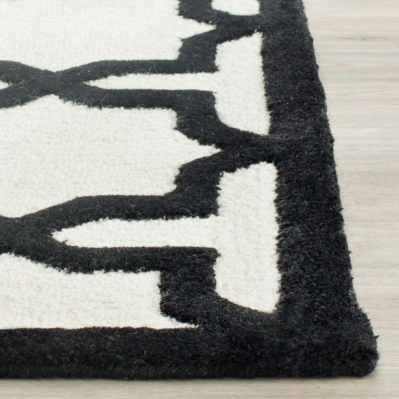 Hand-Tufted Black and Ivory Wool Area Rug, 2'6" x 4'