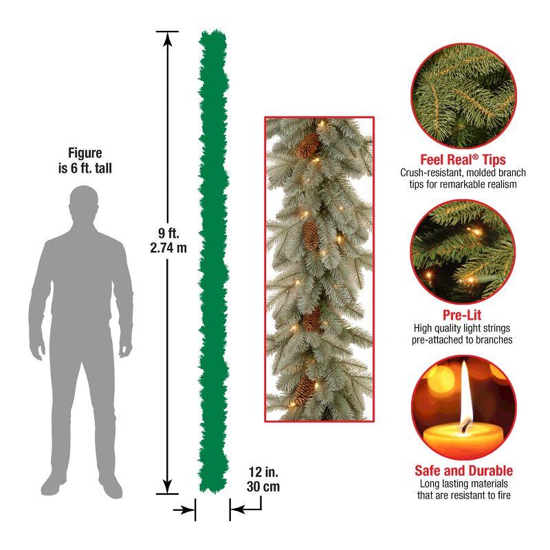 National Tree Company Pre-Lit 'Feel Real' Artificial Christmas Garland, Green, Arctic Spruce, White Lights, With Pine Cones, Plug In, 9 Feet