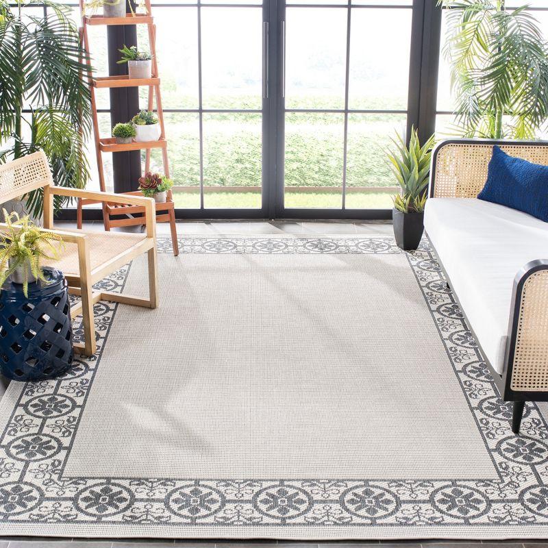 Ivory & Charcoal Geometric 8' x 10' Easy-Care Synthetic Area Rug