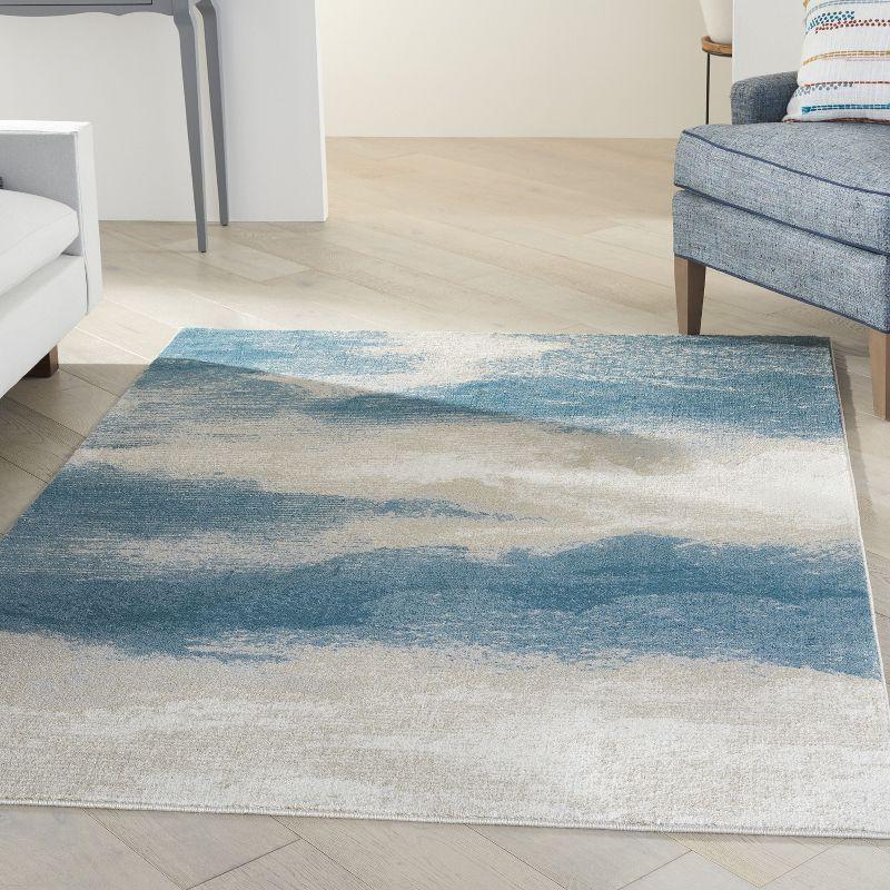 Ivory and Teal Abstract Flat Woven Synthetic Rug, 5' x 7'