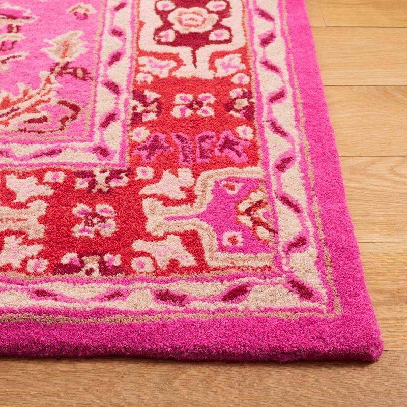 Handmade Bohemian Chic Red & Pink Wool Area Rug - 4' x 6'