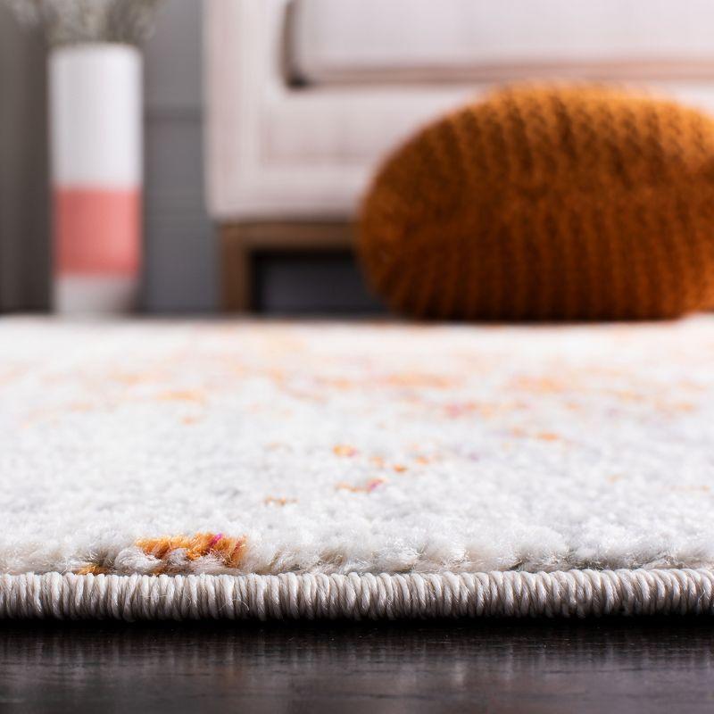 Ivory and Orange Rectangular Synthetic Area Rug