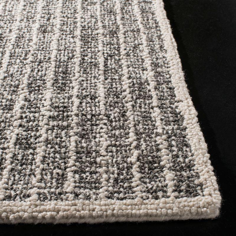 6' x 6' Black and Ivory Wool Abstract Tufted Area Rug