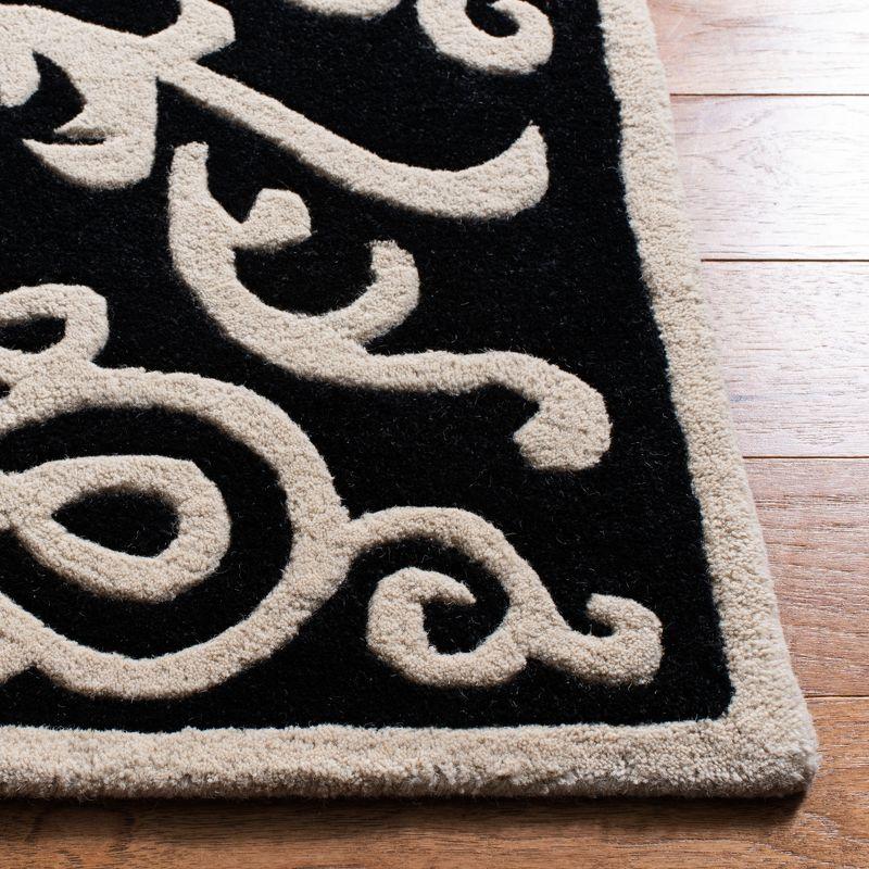 Handmade Black and Ivory Tufted Wool Area Rug, 8'3" x 11'