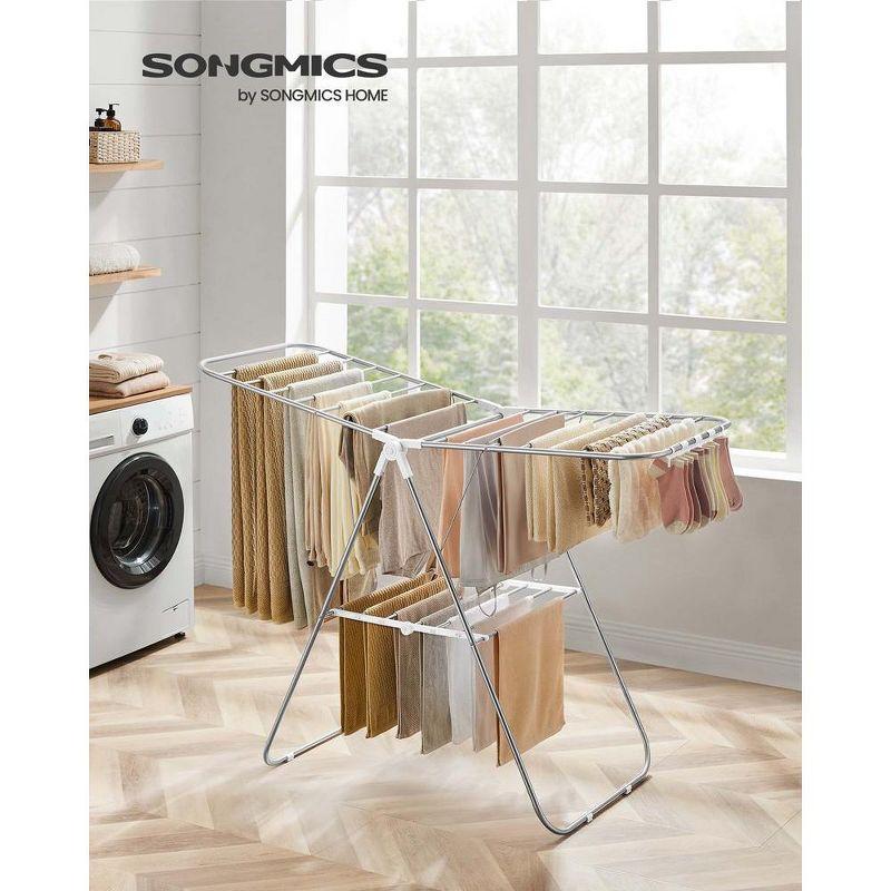 SONGMICS Foldable Clothes Drying Rack with Sock Clips Laundry Drying Rack with Height-Adjustable Gullwings