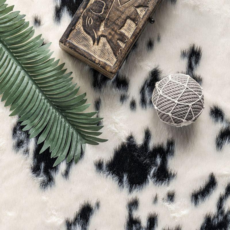 Nuloom Marcia SpinClean Machine Washable Faux Cowhide Area Rug, Shaped 3' 10" x 5', Black